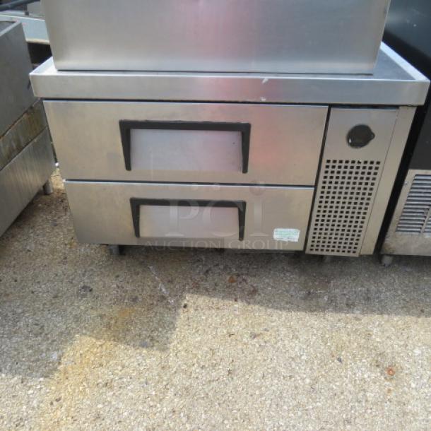True TRCB-36 2 Drawer Chef Base, stainless steel, on casters. 36x2x25 inches. 115 Volt. Used condition.