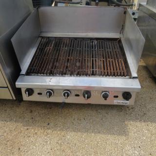 US Range natural gas charbroiler, 36x33x14 inches, stainless steel, working condition, featuring control knobs and grates.
