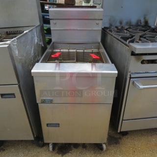 Pitco SG18 natural gas deep fryer, two baskets, on casters, stainless steel, size 20x37x43 inches, working condition.