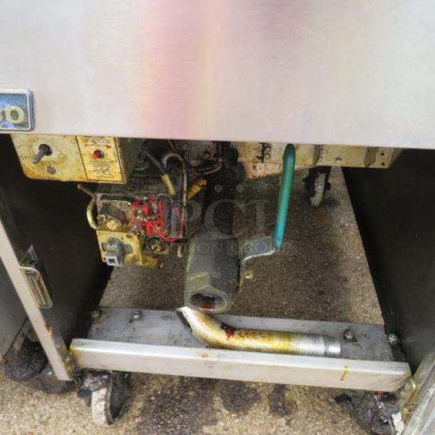 Pitco SG18 natural gas deep fryer on casters with two baskets. Measures 20x37x43 inches. Shows signs of use.