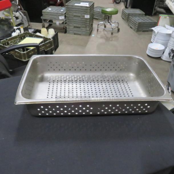 Full-size 4-inch deep perforated hotel pan, stainless steel, used condition, ideal for commercial kitchen use.