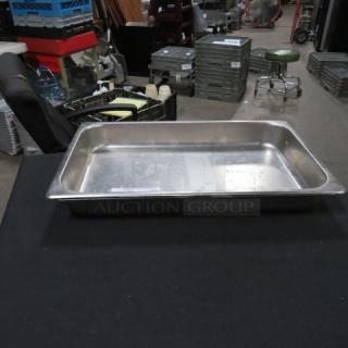 Full-size stainless steel hotel pan, 2.5-inch deep, in used condition, suitable for catering or food service.