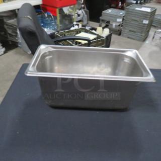 1/3 size 6-inch deep hotel pan, stainless steel, used condition. No visible markings or labels. Ideal for commercial kitchens.
