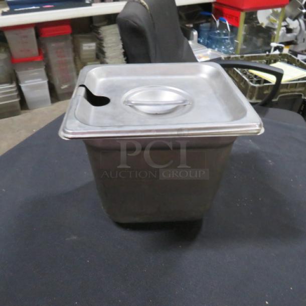 1/6 size, 6-inch deep stainless steel hotel pan with lid; features a spoon slot; used condition.