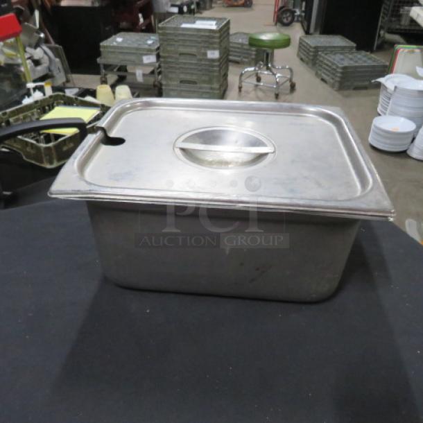 Half-size 6-inch deep hotel pan with lid, stainless steel, pre-owned, good condition, slight wear marks.