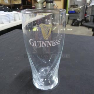 Guinness beer glass with logo, clear glass, gently used condition, smooth curved design. Item number: 17XBID.