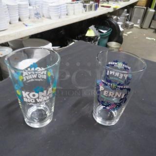 Assorted beer glasses featuring Kona Big Wave and Wicked Weed Pernicious designs, excellent condition, clear glass.