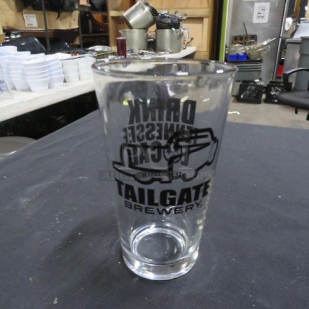 Tailgate Brewery beer glass with logo, clear glass, excellent condition. Ideal for collectors or enthusiasts.