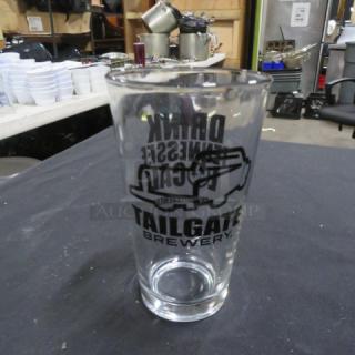 Tailgate Brewery beer glass with logo, clear glass, excellent condition. Ideal for collectors or enthusiasts.