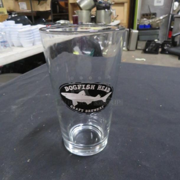 Dogfish Head craft beer glass, 14XBID, featuring the brewery logo, in good condition.