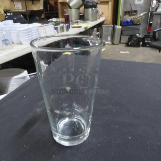 Clear beer glass, 10XBID model, in good condition, standard pint size. No visible markings or defects.