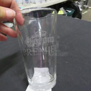 Corona Premier beer glass with etched logo, clear glass, excellent condition. Suitable for collectors or beer enthusiasts.