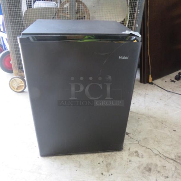 Haier 1-Door Refrigerator, Model HC27SF10RB, black, 18x18x26 inches. Working condition, door needs adjustment.