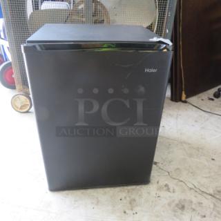 Haier 1-Door Refrigerator, Model HC27SF10RB, black, 18x18x26 inches. Working condition, door needs adjustment.