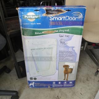 PetSafe Electronic SmartDoor, new in box, with packaging showing features. Retail price marked $195, selling for $100.