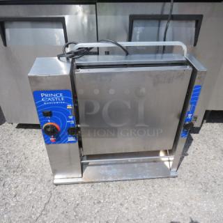 Prince Castle vertical toaster, Model 297-T12PHH, 115 Volt, 1500 Watt, stainless steel, blue panel design, used condition.