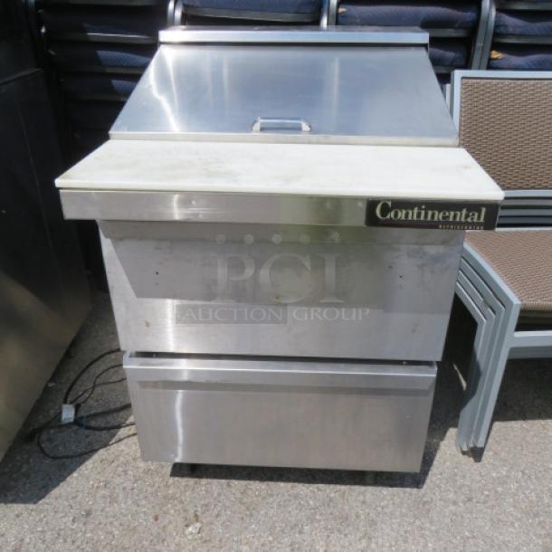 Continental SW27-12M refrigerated prep table, 2 drawers, on casters, 28x34x42 inches, stainless steel, 115V, visible branding.