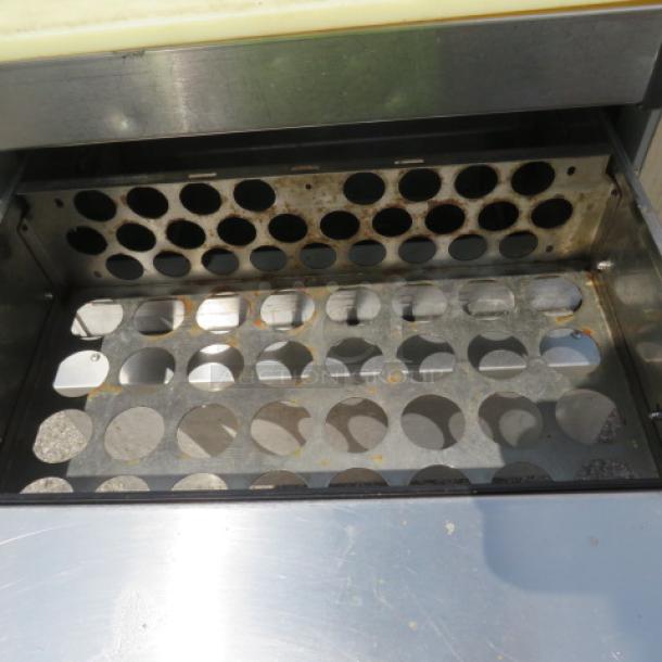 Continental SW27-12M refrigerated prep table with 2 drawers, on casters. Measures 28x34x42 inches. 115 Volt.
