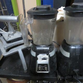 Waring BB300 commercial blender, 120V, with visible wear, black base, clear container, dual-speed control.