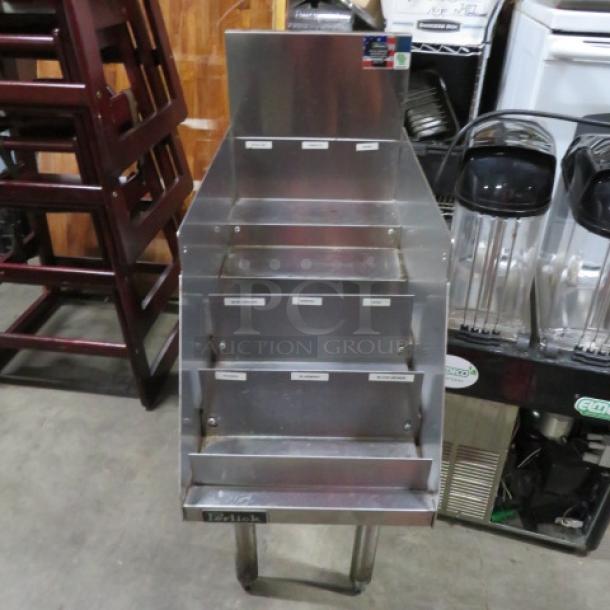 Perlick stainless steel 5-tier bottle display, 12x24x35.5 inches, used condition, sturdy, ideal for organizing bottles.