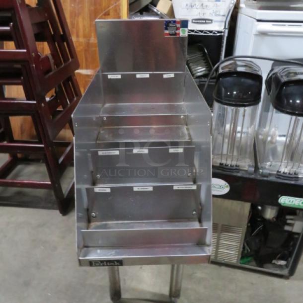 Perlick stainless steel 5-tier bottle display, 12x24x35.5 inches. Features labels for organization. Excellent condition.
