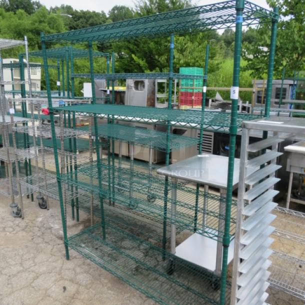 Green coated Metro shelf with four wire shelves, dimensions 60x18x74 inches, in good condition.