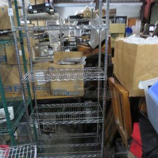 Metro metal shelf unit with five wire shelves on casters, 30x14x80 inches. Used condition, ideal for storage or organization.