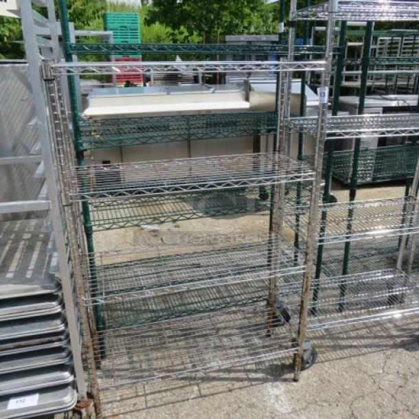 Metro metal shelf unit with four wire shelves on casters, measuring 36x14x54 inches. Ideal for storage and easy mobility.
