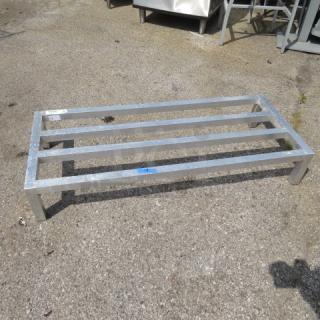 Aluminum dunnage rack, 48x20x8 inches, sturdy frame with five slats, suitable for storage, shows minor outdoor use.