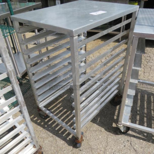 Durable metal speed rack on casters, 20.5x26x39 inches, with multiple shelves. Ideal for kitchen or storage use.