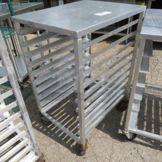 Durable metal speed rack on casters, 20.5x26x39 inches, with multiple shelves. Ideal for kitchen or storage use.
