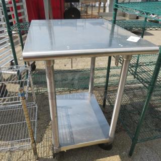 Stainless steel table with undershelf, 24x30x55 inches, on caster wheels. Durable, versatile kitchen or utility use.