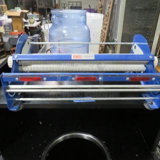 Uline tabletop tape and label dispenser, Model KTDL18, in blue metal, excellent condition, with spring-loaded mechanism.