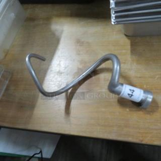 Stainless steel 20-quart hook on wooden surface, labeled with "44." Excellent condition. Auction item for industrial mixers.