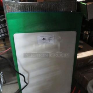 Assorted cutting boards, green and white, lightly used; label indicating "46" and "4XBID," stored vertically.