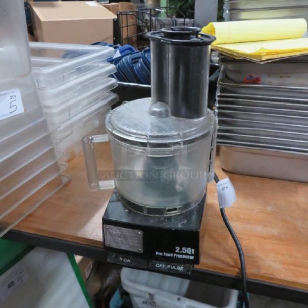 Waring 2.5 Quart Commercial Food Processor, black base, clear bowl, used condition, visible power cord, and control switch.