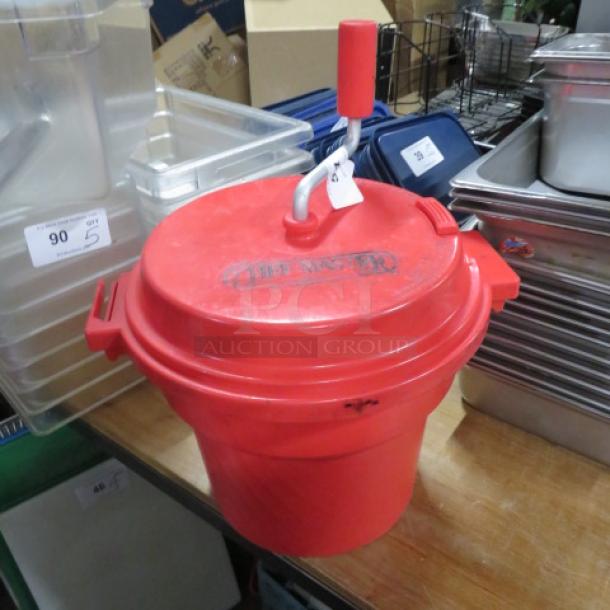 Red Chef Master Salad Spinner with hand crank, used condition, large capacity. Brand logo visible on the lid.