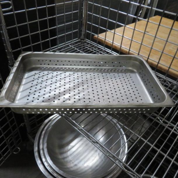 Stainless steel perforated hotel pan, full size, 4-inch deep. Ideal for commercial kitchen use. Excellent condition.