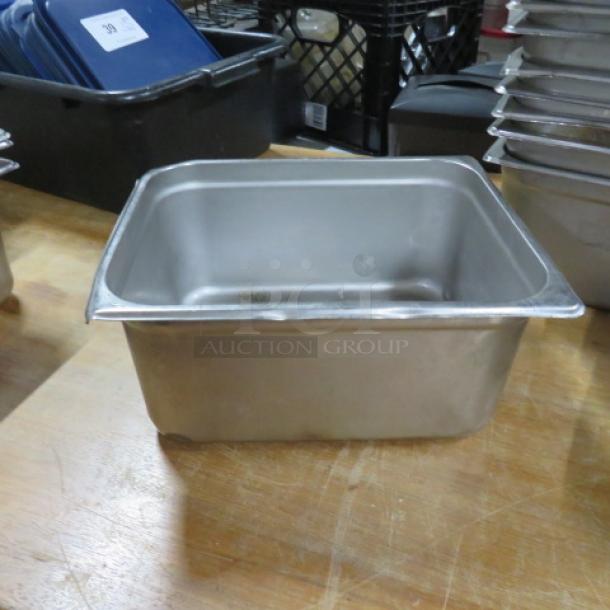 Half size, 6-inch deep stainless steel hotel pan, used condition. Ideal for kitchen or catering use.