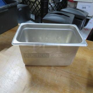 1/4 size hotel pan, 6-inch deep, stainless steel, used condition. Ideal for food service and storage. Model 3XBID.