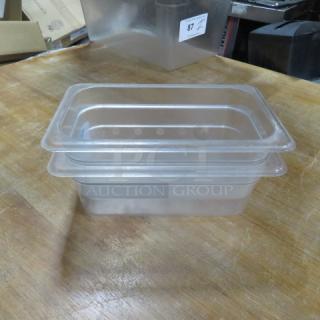 1/4 size 4-inch deep clear food storage container, stackable design, gently used condition. Label: "2XBID."