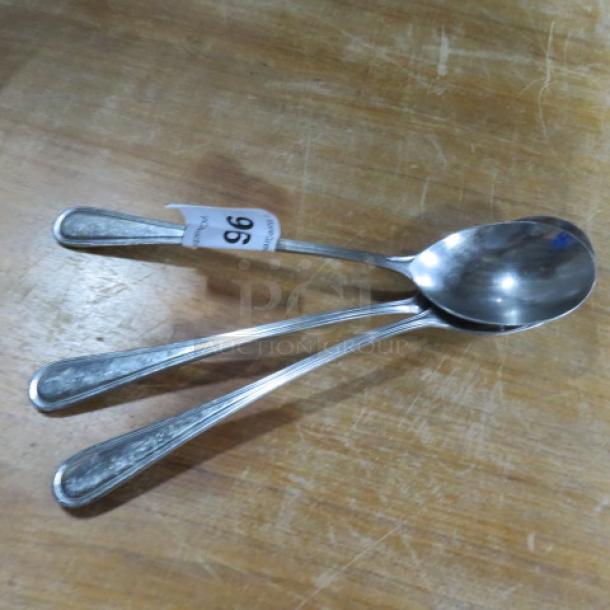 Stainless Steel Spoon set, 3 pieces, slightly used, features decorative handles, tagged with number 96.