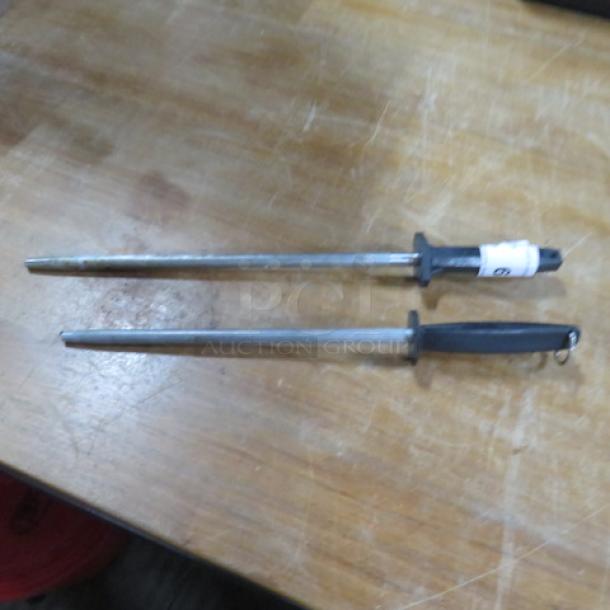 Knife Sharpener 2XBID set, featuring two metal sharpening rods with black handles. One rod includes a label with "2XBID." Slightly worn condition.