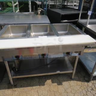 APW Wyott 3 Well Steam Table with stainless steel under shelf and cutting board, dimensions 46x30x34.5 inches.