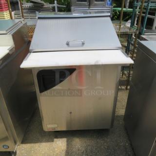 Turbo Air TST-28SD-12 refrigerated prep table, stainless steel, single door, 1 rack, cutting board, on casters, 28x36x45 inches.