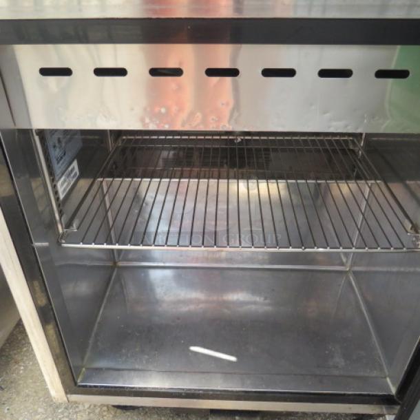 Turbo Air TST-28SD-12 refrigerated prep table with one door, single rack, and cutting board on casters, 28x36x45, 115V.