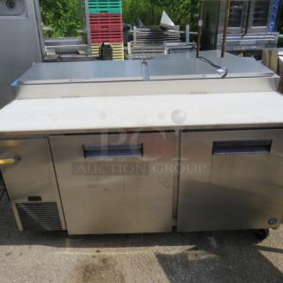 Hoshizaki PR67A refrigerated prep table with two doors, four racks, cutting board, and casters, 67x35x44 inches, 115V.