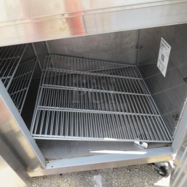 Hoshizaki PR67A refrigerated prep table, stainless steel, 2 doors, 4 racks, cutting board, on casters, 67x35x44 inches, 115V.