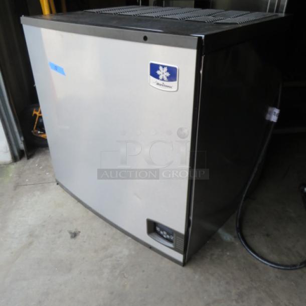 Manitowic Ice Maker, Model IY1106A-261, 208-230V, stainless steel, working condition, 30x25x30 inches, branded logo visible.