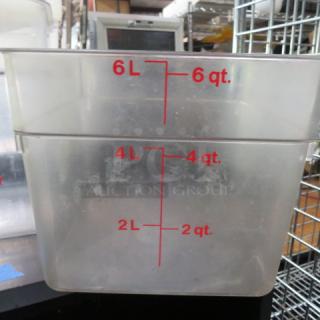 Clear 6 quart food storage container with red measurement markings in liters and quarts. Slightly used condition.